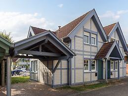 Cozy Holiday Home with Wood Burning Stove near Water