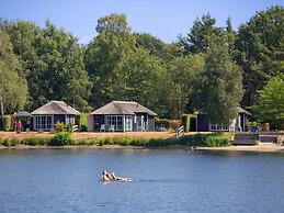 Thatched Lodge With a Combination Microwave, at a Holiday Park in Twen