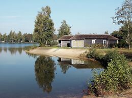 Thatched Lodge With a Combination Microwave, at a Holiday Park in Twen