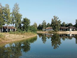 Thatched Lodge With a Combination Microwave, at a Holiday Park in Twen