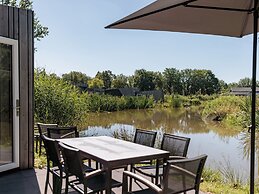Modern Waterfront Lodge, Located Within Green Surroundings