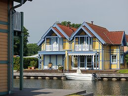 Cozy Holiday Home with Wood Burning Stove near Water