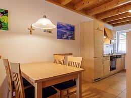 Cozy Holiday Home with Wood Burning Stove near Water