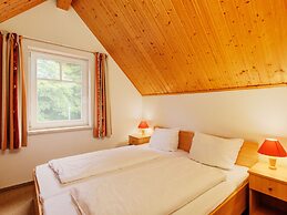 Cozy Holiday Home with Wood Burning Stove near Water