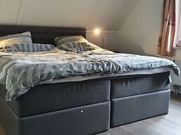 Nice Holiday Home with Sauna & Hot Tub near Wadden Sea