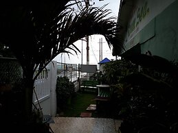 Room in Guest Room - Posada Green Sea in the Harmony Hall Hill Area of