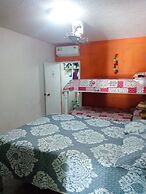 Room in Guest Room - Green Sea Inn in the San Luis Sector