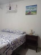 Room in Guest Room - Green Sea Inn in the San Luis Sector