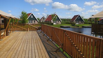 Campsite - Combined Tents With Kitchen and Bathroom Located Near a Pon