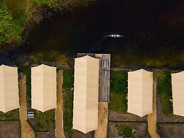 Campsite - Combined Tents With Kitchen and Bathroom Located Near a Pon