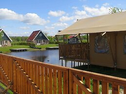 Campsite - Combined Tents With Kitchen and Bathroom Located Near a Pon