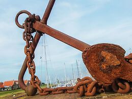 Nice Chalet with Fireplace near Oosterschelde