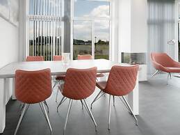 Nice Chalet with Fireplace near Oosterschelde