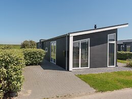 Nice Chalet with Fireplace near Oosterschelde