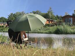 Beautiful Chalet in a Holiday Park, With a Dishwasher Right on a Pond