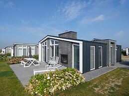 Cozy Chalet with Fireplace near Oosterschelde