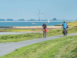Stylish Holiday Home with Fireplace near Oosterschelde