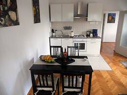 Spacious Apartment With Terrace & Outdoor Kitchen Surrounded by a Gard
