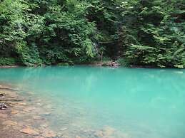 Traditional Wooden House by the River