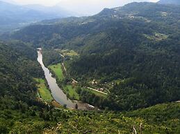 Traditional Wooden House by the River