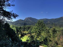 Traditional Wooden House by the River
