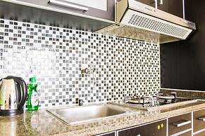 Strategic and Comfy 2BR City Home MOI Apartment