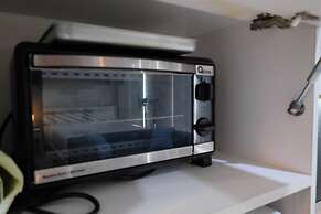 Elegant and Comfy Studio Azalea Suites Apartment Cikarang