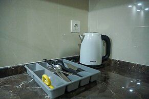 Strategic Location 1BR Apartment @ Puri Mansion near Puri By Travelio