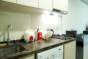 Modern with City View @ Studio Puri Mansion Apartment By Travelio