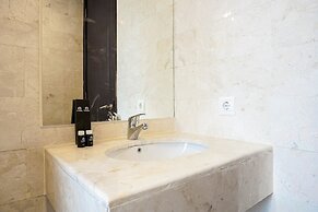 Cozy 2BR at Empyreal Epicentrum Apartment By Travelio