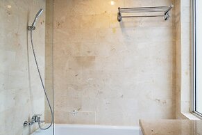 Cozy 2BR at Empyreal Epicentrum Apartment By Travelio