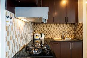 Cozy 2BR at Empyreal Epicentrum Apartment By Travelio