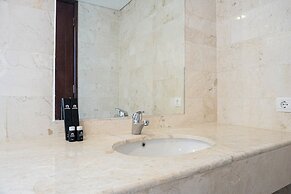 Cozy 2BR at Empyreal Epicentrum Apartment By Travelio