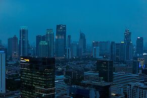 Cozy 2BR at Empyreal Epicentrum Apartment By Travelio