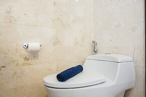 Cozy 2BR at Empyreal Epicentrum Apartment By Travelio