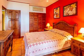 Warm Interiors and Orange Hues on Ground Floor in Front of Beach