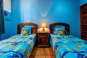 Warm Interiors and Orange Hues on Ground Floor in Front of Beach