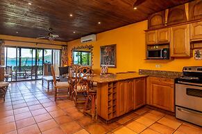 Warm Interiors and Orange Hues on Ground Floor in Front of Beach