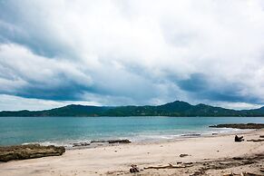 Warm Interiors and Orange Hues on Ground Floor in Front of Beach