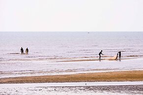 Saadani Safari Lodge - bush, river, beach