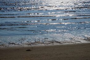 Saadani Safari Lodge - bush, river, beach