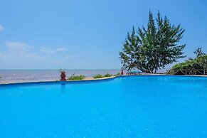 Saadani Safari Lodge - bush, river, beach