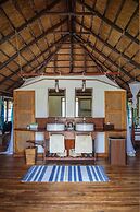 Saadani Safari Lodge - bush, river, beach