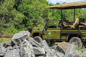 Saadani Safari Lodge - bush, river, beach