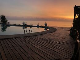 Saadani Safari Lodge - bush, river, beach