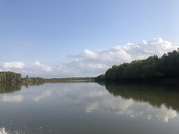 Saadani Safari Lodge - bush, river, beach