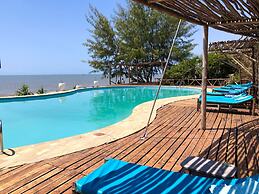 Saadani Safari Lodge - bush, river, beach