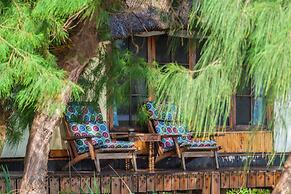 Saadani Safari Lodge - bush, river, beach