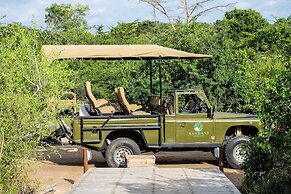 Saadani Safari Lodge - bush, river, beach