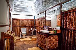 Saadani Safari Lodge - bush, river, beach